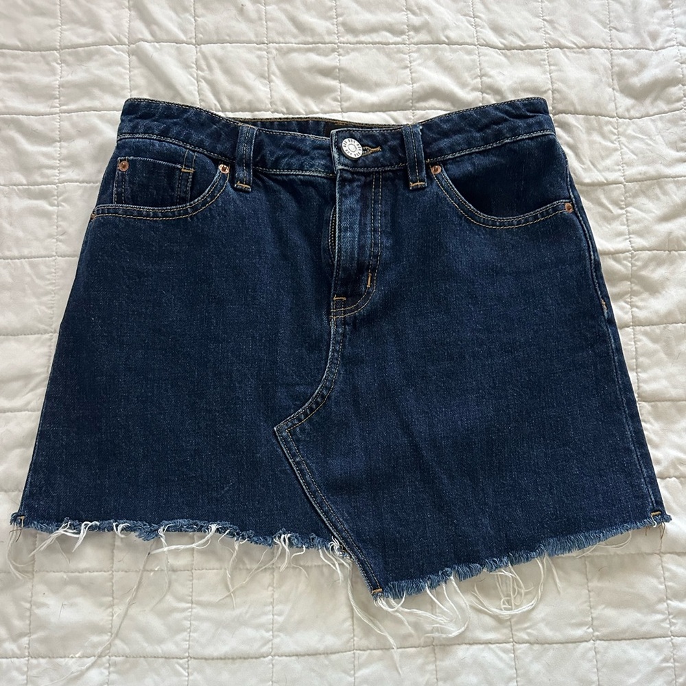 Dark raw hem denim skirt from Urban Outfitters